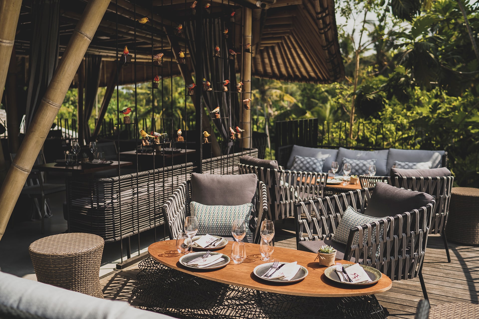 A,Tranquil,Outdoor,Patio,Scene,Features,Stylish,Wicker,Furniture,Surrounding