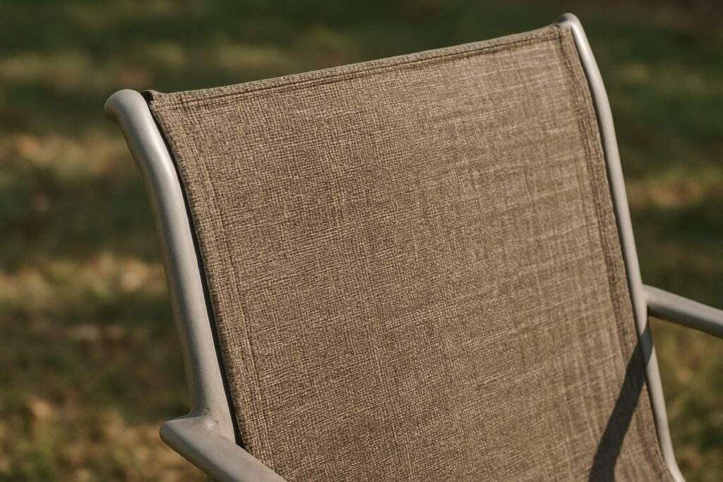 Close-up of a sling outdoor chair with taut fabric