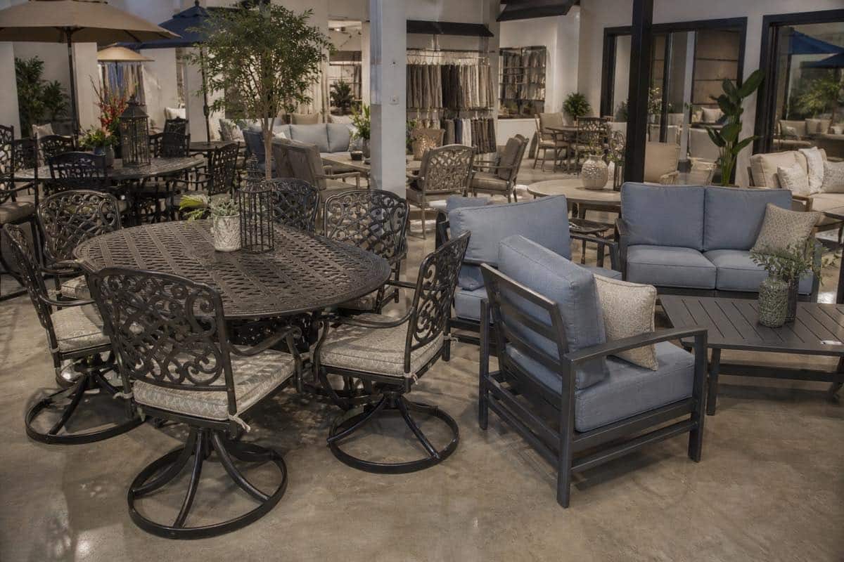 Extruded and cast aluminum patio furniture compared in a Charlotte showroom