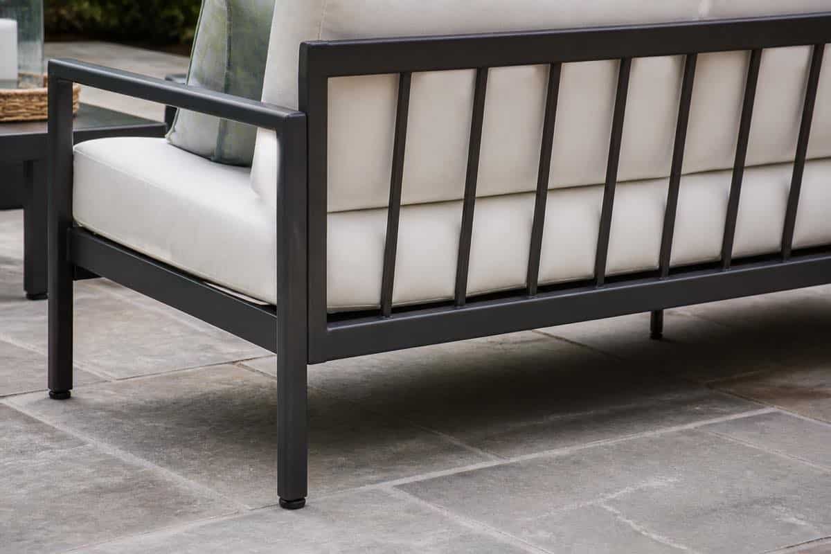 Clean extruded aluminum patio sofa frame joints in a Charlotte outdoor setting