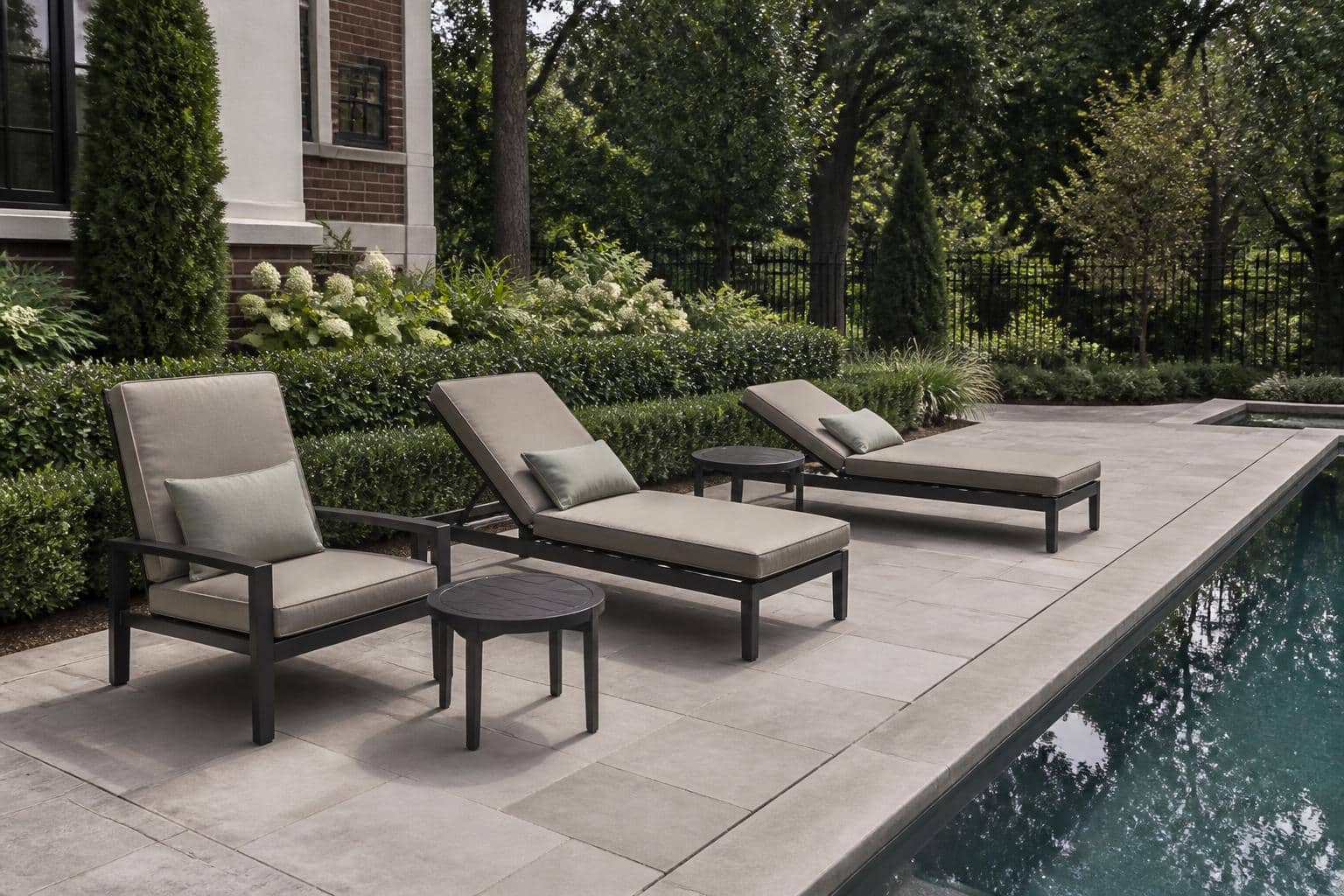 Pair of outdoor chaise lounges spaced along a Charlotte pool deck at different recline angles