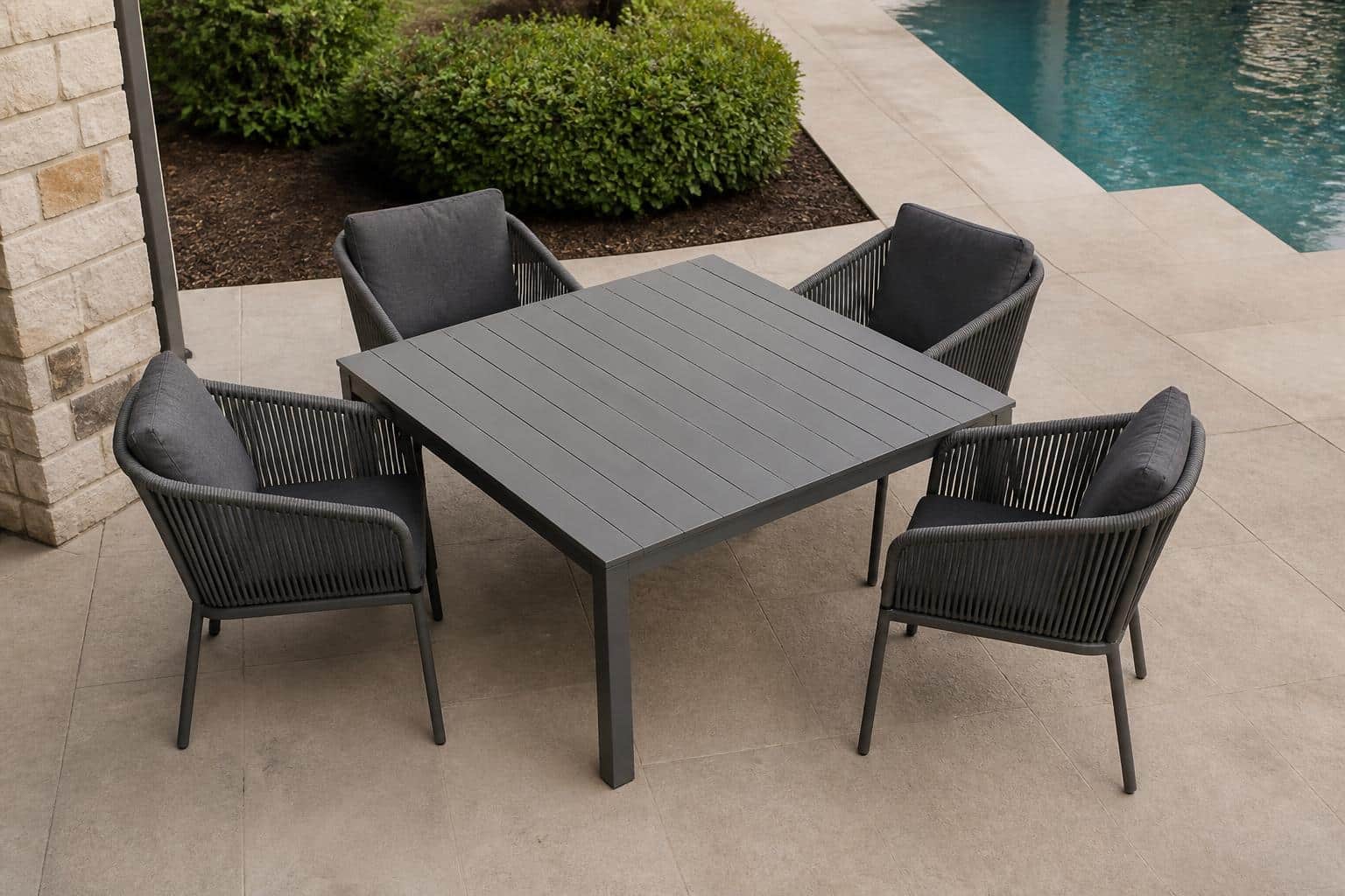 Wide view of a Charlotte outdoor dining area with arm chairs properly spaced around a rectangular patio table