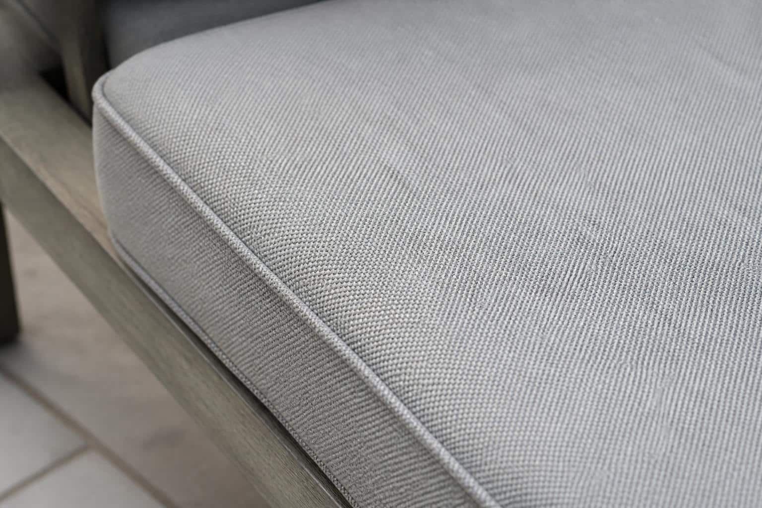 Outdoor cushions in Outdura and Sunbrella fabrics on a patio sofa