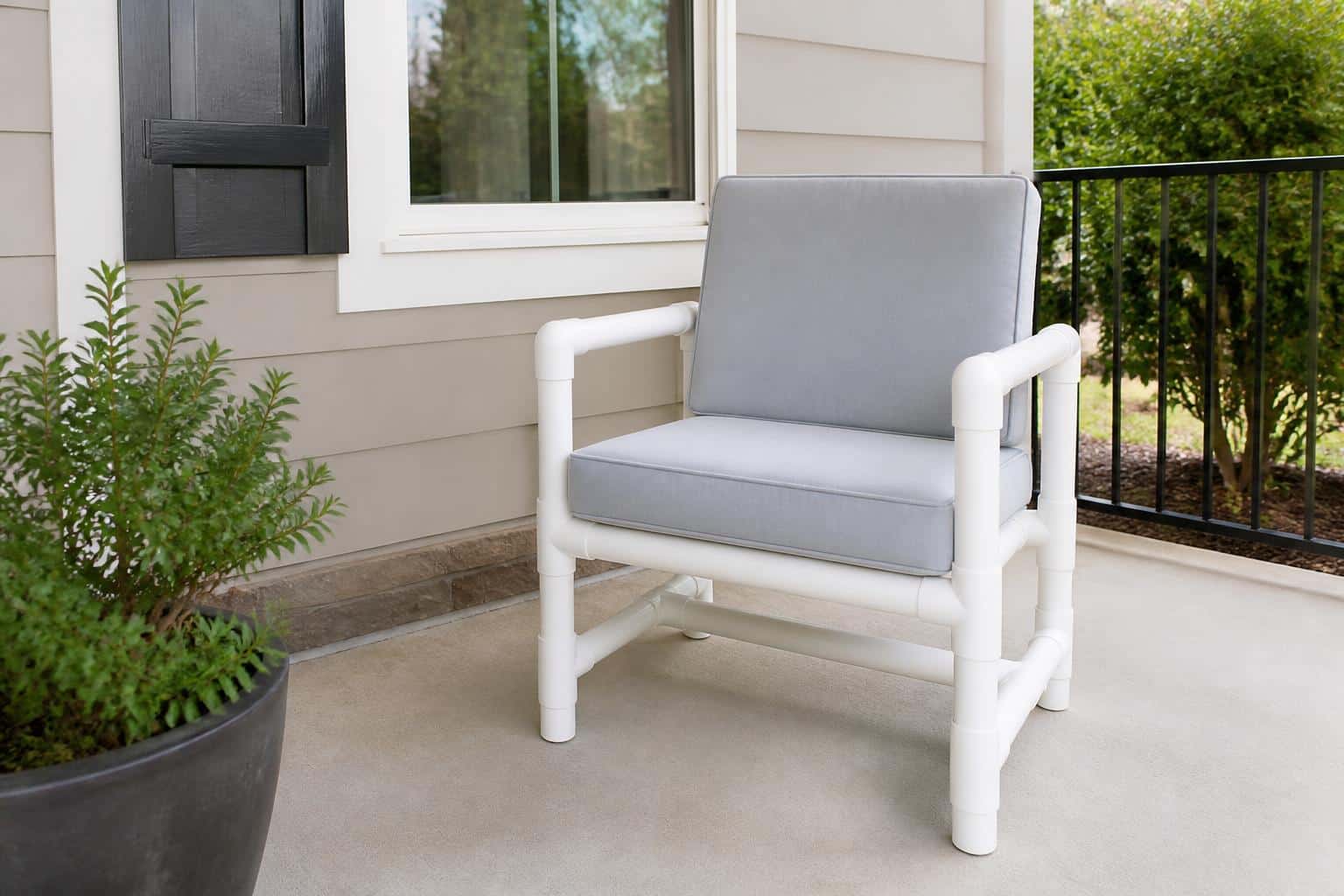 White PVC pipe patio chairs on a covered patio
