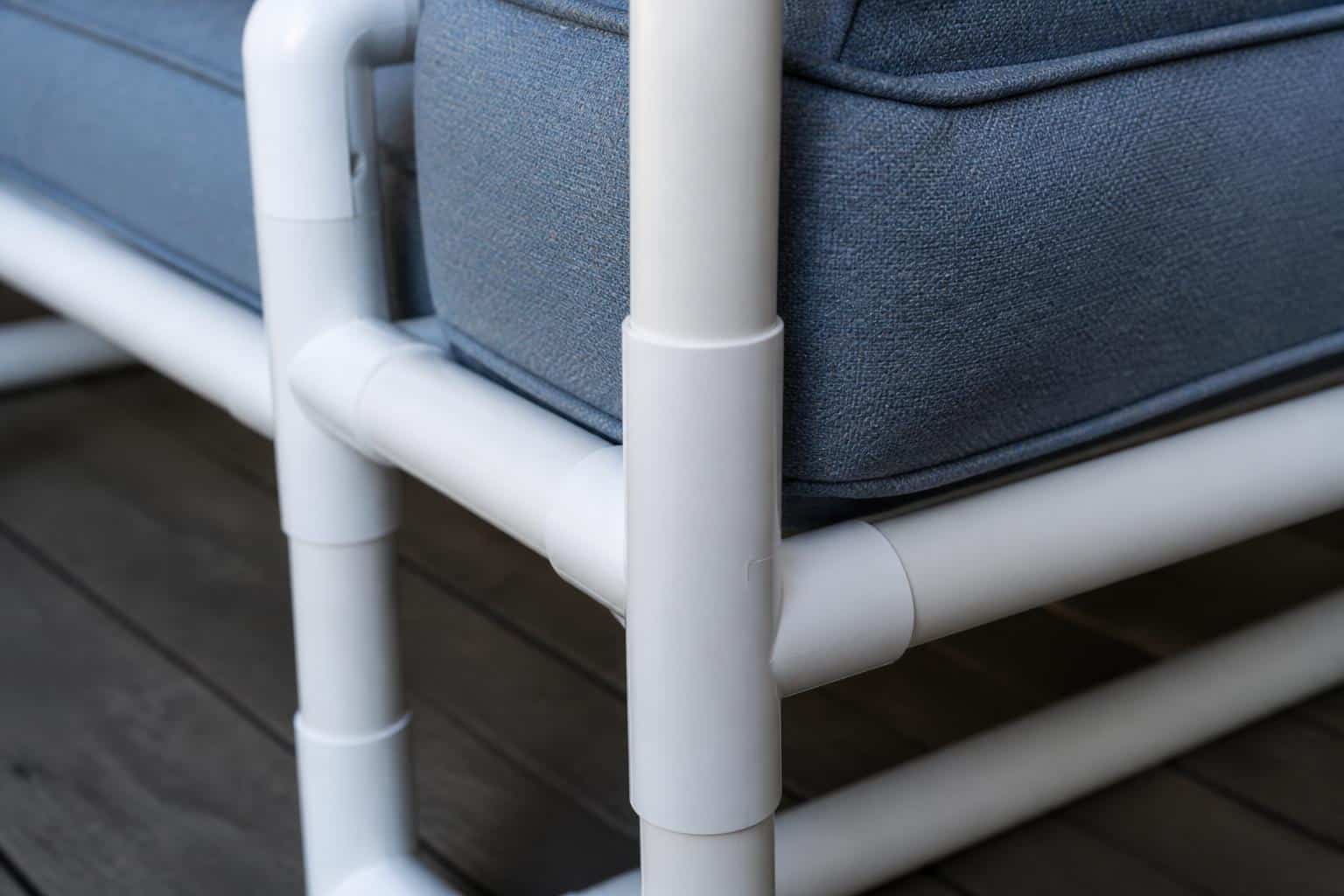 White PVC pipe patio chairs arranged around a shaded porch