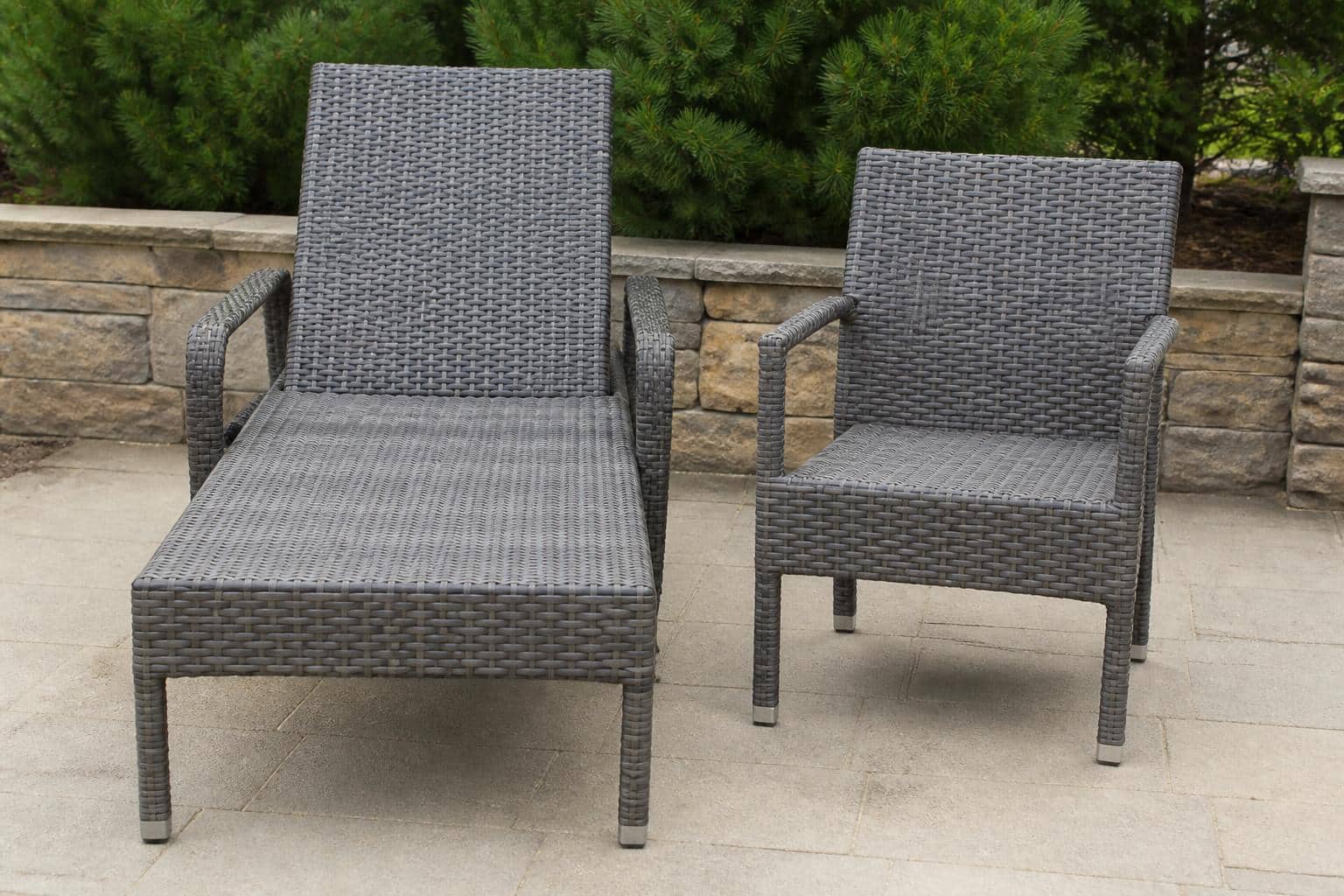 Close view of a resin wicker chair cushion compressed against the woven seat deck showing finished seat height