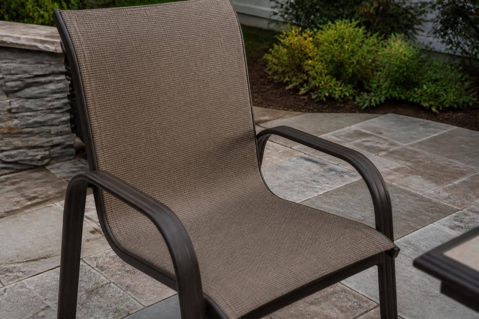 sling patio chair fabric tension example on an outdoor patio