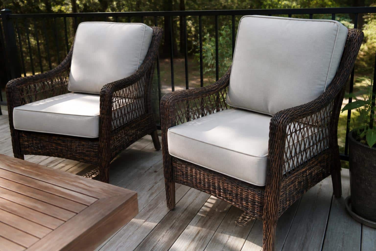 Wicker seating group on a residential patio with shaped cushions following curved frames